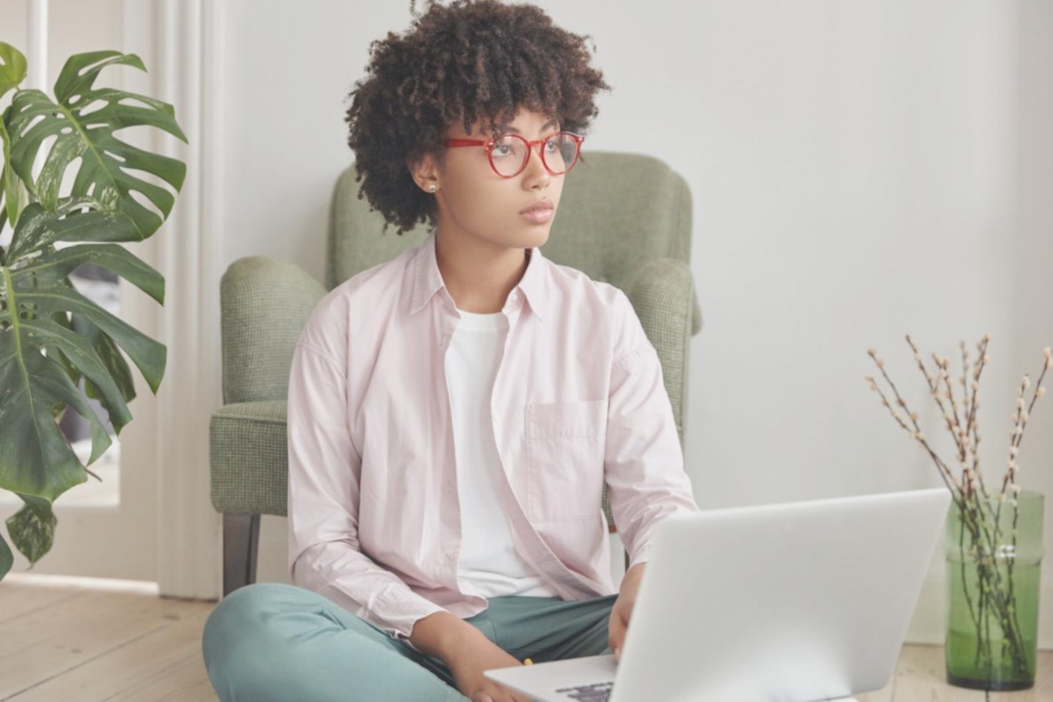 Student working on 3D game environment design with multiple monitors showing game assets and coding interface